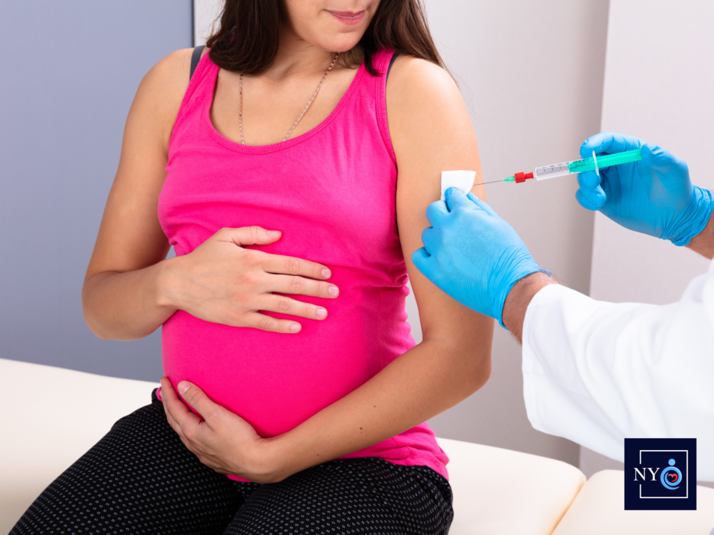 pregnant woman receiving a vaccine to prevent maternal infection and stay healthy during pregnancy